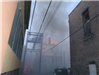 Smoke and flames in back alley Hume Alley